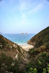 Secluded Cove with Pristine Beach and Distant Islands