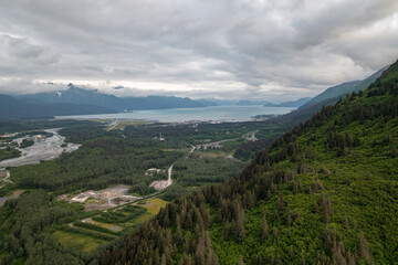 Fototapeta premium Aerial view of harbor town Seward, Alaska mountain landscape with Resurrection Bay and Gulf of Alaska ocean water