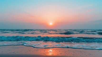 Obraz premium Experience the peace of a tranquil beach at sunset, with soft waves lapping gently under a colorful sky.