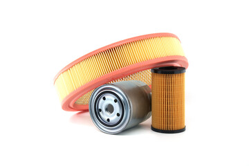 Car engine filters assortment including air filter, oil filter and fuel filter isolated on white