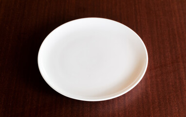 empty white plate on table