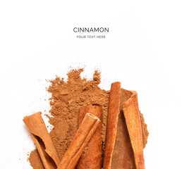 Creative layout made of cinnamon sticks on the white background. Food concept. Macro concept.