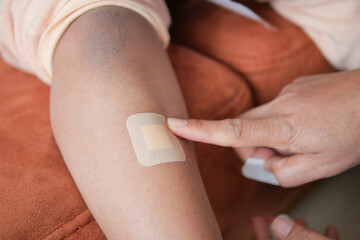 Applying a Bandage on the Elbow Area Following a Minor Injury for Proper Care and Healing