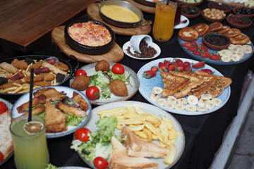 A Delicious and Colorful Spread of Various Delectable Dishes Decoratively Arranged on a Table
