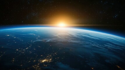 Obraz premium A captivating view of Earth from space during a blue sunrise, where the horizon glows with shades of blue and gold.