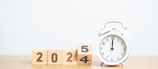 2024 end year to Happy New Year 2025 with vintage alarm clock. Christmas, New Start, Resolution,...