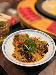 chinese hotplate and various dumpling and meat