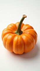 Obraz premium Close-up of orange pumpkin on a white background