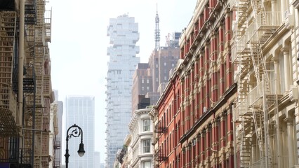 New York City Manhattan Soho fashion district near Broadway street. USA urban building facade, old american architecture. Shopping in NYC, United States. Business and residential real estate. Lantern