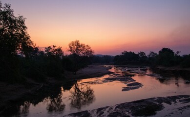 Obraz premium Sunset over the Levubu river in the Kruger Park in South Africa