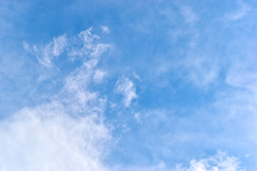 beautiful blue sky and white fluffy group of clouds with sunrise in the morning, natural background