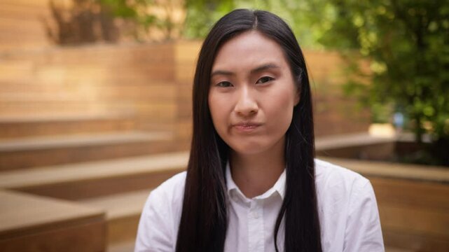 Close up Asian Korean woman businesswoman negative waving shaking head answer no rejection disagreement city business girl deny prohibit refuse portrait female student never not lady warning outdoors