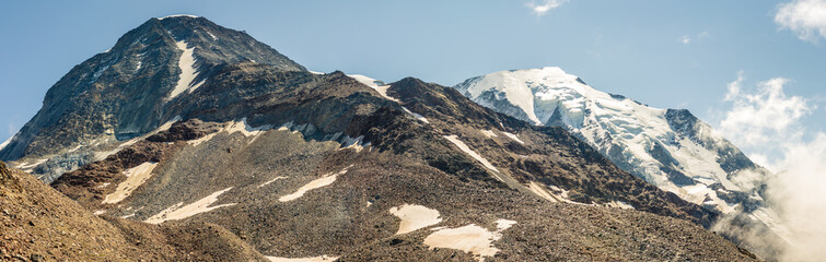 Tops Dôme du Goûter with glacier and Aiguille du Goûter with Goûter Refuge on way to Mont Blanc