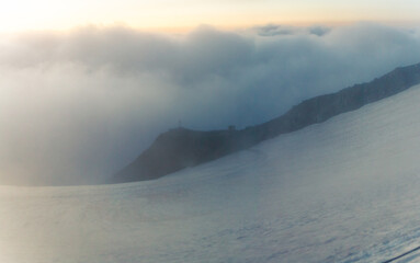 Morning shot of foggy and low clouds weather way of glacier top Mont Blanc france normal way