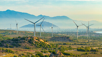 Landscape with Turbine Green Energy Electricity, Windmill for electric power production, Wind turbines generating electricity on field at Phan Rang, Ninh Thuan, Vietnam. Clean energy concept. © Dong