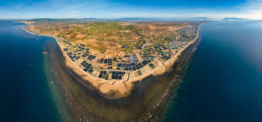 Aerial view of the prawn farm with aerator pump in front of Ninh Phuoc, Ninh Thuan, Vietnam. The...