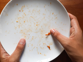 Food stains stuck to the plate are white