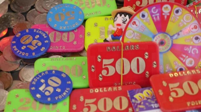 Token in a coin pusher machine at a funfair