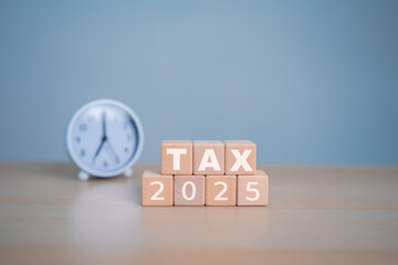 Tax season with wooden alphabet blocks. submit tax for payment tax documents online to the government.