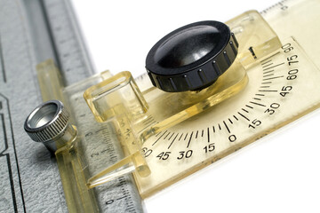 Close-up of an old device for drawing and measuring geometric angles. The mechanism of the drawing board of the T-square.