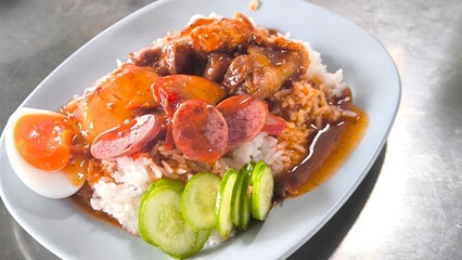 Red pork and crispy pork on rice, food in Thailand.