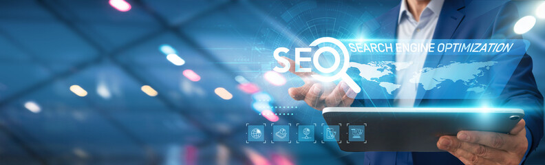 Businessman using tablet analyzing search engine optimization metrics, traffic, conversion rates,...