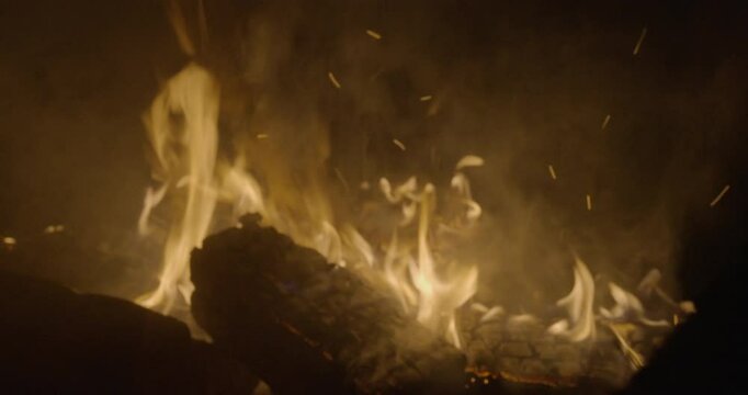Close-up of a campfire burning in the night