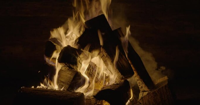Close-up of a campfire burning in the night