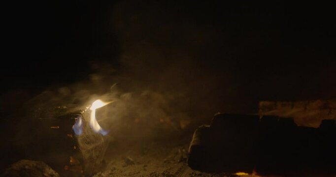 Campfire burning in the night