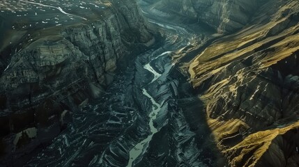 Obraz premium Aerial View of a Glacier Winding Through Rugged Terrain