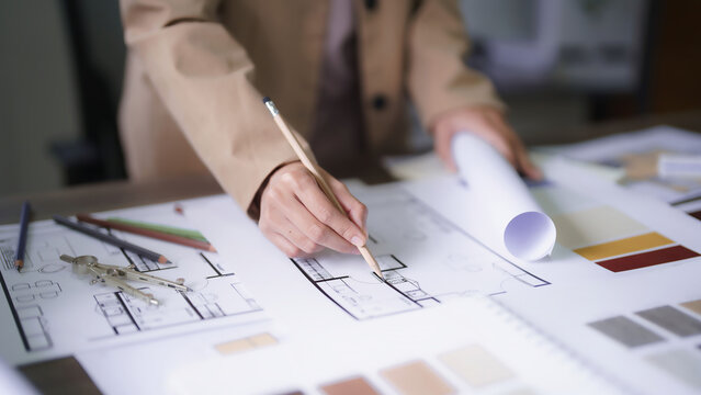 Female architect design architecture interior building project to drawing construction on blueprint