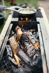 Outdoor Firewood Grill Cooking with Flames