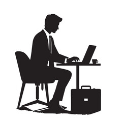 Silhouette of a businessman working at his desk.