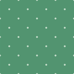 Seamless polka dot pattern on a dark green background