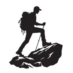 Fototapeta premium Silhouette of a hiker with a backpack walking on a mountain.