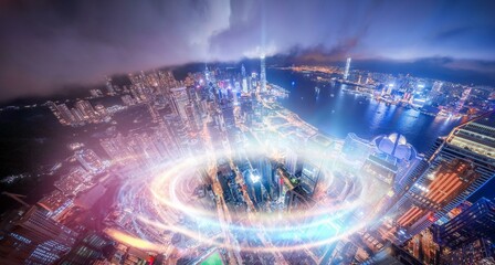 Aerial night view of a city in Hong Kong, China with glowing lights from skyscrapers and streets.