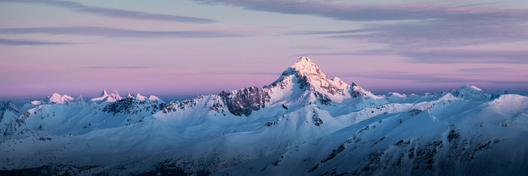 Panoramic view of Queyras mountain range at sunrise; mountains covered by snow  - Powered by Adobe