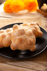 Pan de Muerto. Typical Mexican sweet bread that is consumed in the season of the day of the dead. It is a main element in the altars and offerings in the festivity of the day of the dead.