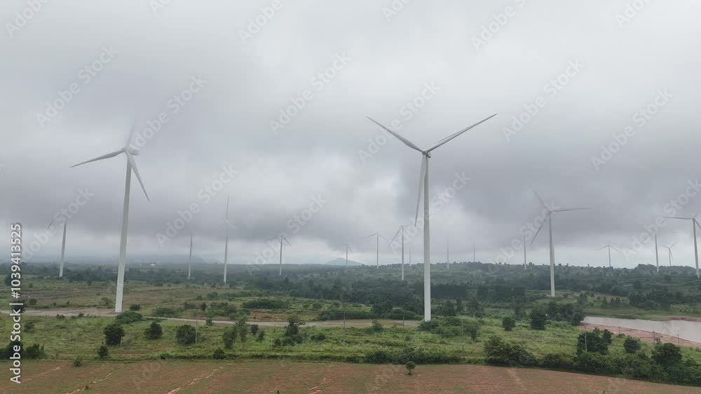 Wall mural large field with many wind turbines in the background
