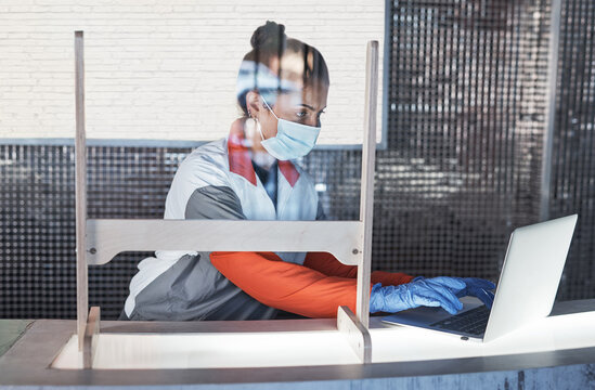 Woman, face mask and typing on laptop at reception for gym compliance, fitness safety and sports schedule. Girl, digital and health checklist, terms and conditions and review policy of covid 19 virus