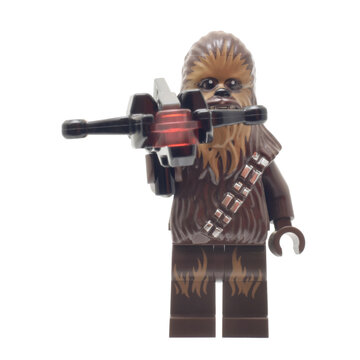 L&ouml;rrach, Germany -July 15th 2024: Lego minifigure of Chewbacca Star Wars Character with weapon isolated on white. Editorial illustrative image of popular plastic constructor to 25 Anniversary.