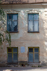 The building has two windows, one of which is open