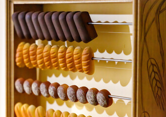 A wooden abacus with a variety of pastries on it