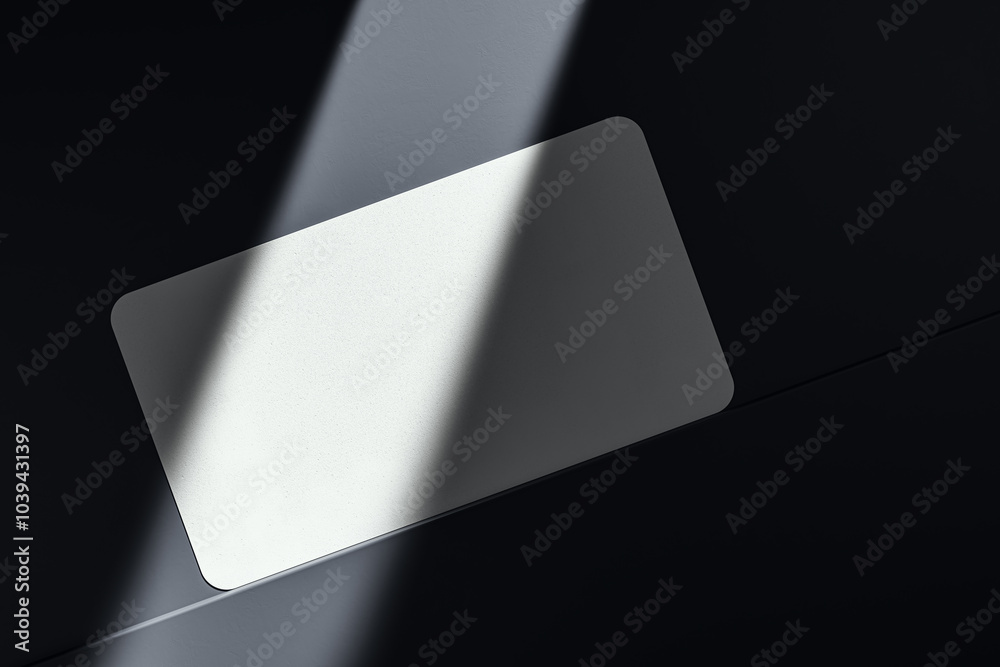 Poster Close up of empty white business card on dark desk surface with sunlight. Ad concept. Mock up, 3D Rendering.