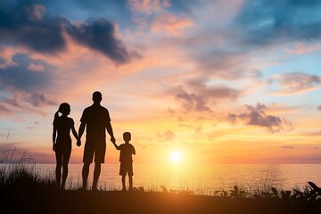 Fototapeta premium Silhouette of a family holding hands at sunset by the ocean, with space for text. Parents and children enjoy a beautiful sunset over the sea.