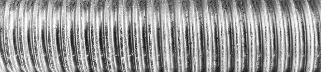 Texture of metal bolt thread. Abstract banner.