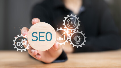 Marketer showing SEO concept ,optimization analysis tools , search engine rankings , social media...