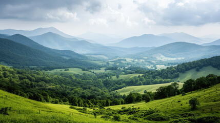 Fototapeta premium lush green landscape of rolling hills and mountains under cloudy sky, showcasing beauty of nature and tranquility. scene evokes sense of peace and serenity