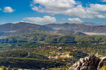 A town on a plateau seen from Sagalassos with mountains behind it