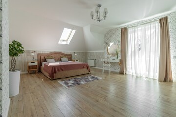 Cozy Attic Bedroom with Modern Design and Natural Light